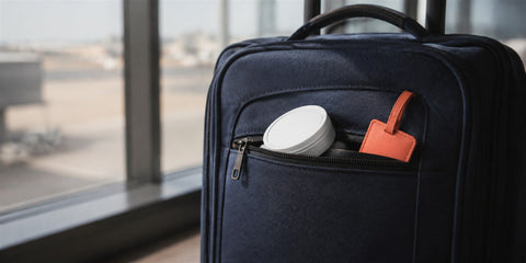 Nicotine pouch can in a travel bag at the airport