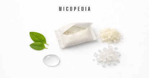 White nicotine pouches beside an open can
