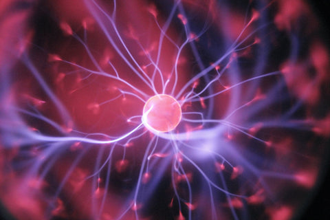 Plasma ball with light filaments resembling nerve signals