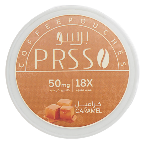 A round white plastic tub of PRSSO Coffee Pouches in caramel flavor, featuring a tan and brown label with Arabic and English text and an illustration of caramel cubes.