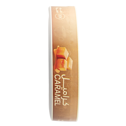 A roll of caramel-flavored ribbon or trim with a tan and brown label featuring an image of caramel cubes and the text 'CARAMEL' and Arabic script, shown on a plain white background.