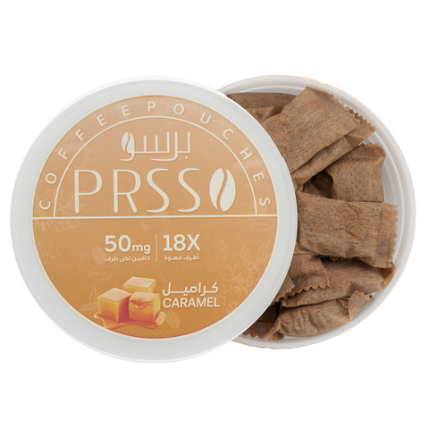 A round white container of PRSS Coffee Pouches with the lid partially covering the open tub, showing brown caramel-coated coffee pouches inside. The label features a warm tan design with white text and Arabic script, indicating 50mg strength and 18x count, with a caramel cube graphic at the bottom.